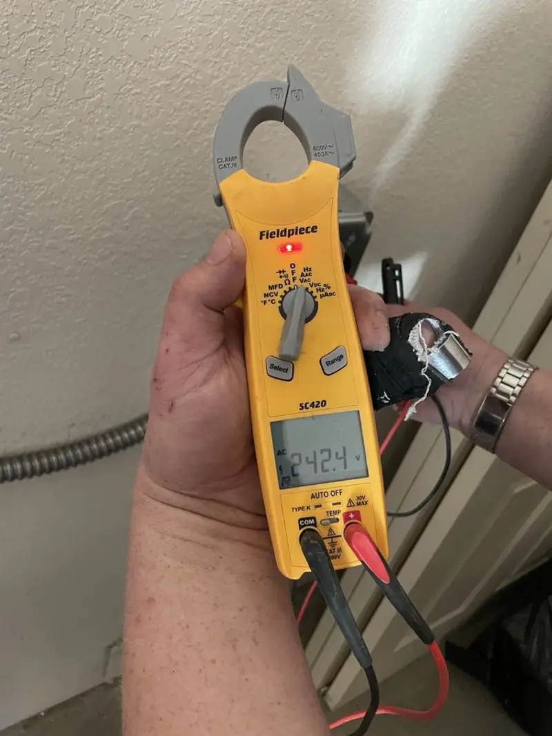 Voltage testing with clamp meter during Outlet Installation in Firebaugh